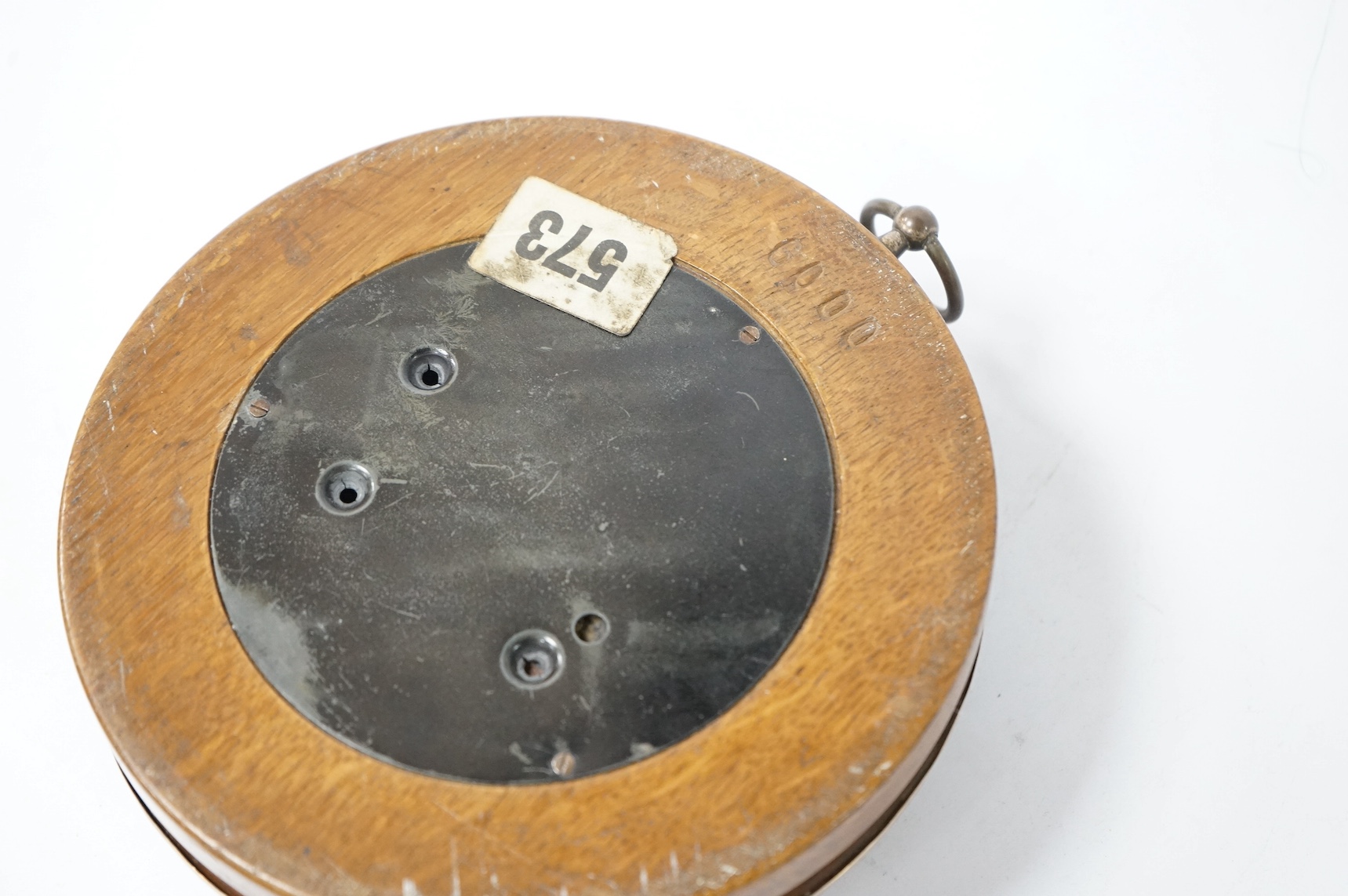 A late 19th/early 20th century silver mounted oak cased hanging barometer, marks rubbed, diameter 15.4cm. Condition - poor